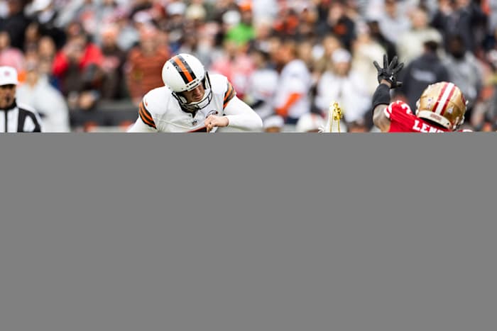 Oct 15, 2023; Cleveland, Ohio, USA; Cleveland Browns place kicker Dustin Hopkins (7) kicks a 29-yard field goal as San Francisco 49ers cornerback Deommodore Lenoir (2) dives to block it during the fourth quarter at Cleveland Browns Stadium. The field goal was good and gave the Browns the lead in the closing minutes of the game.